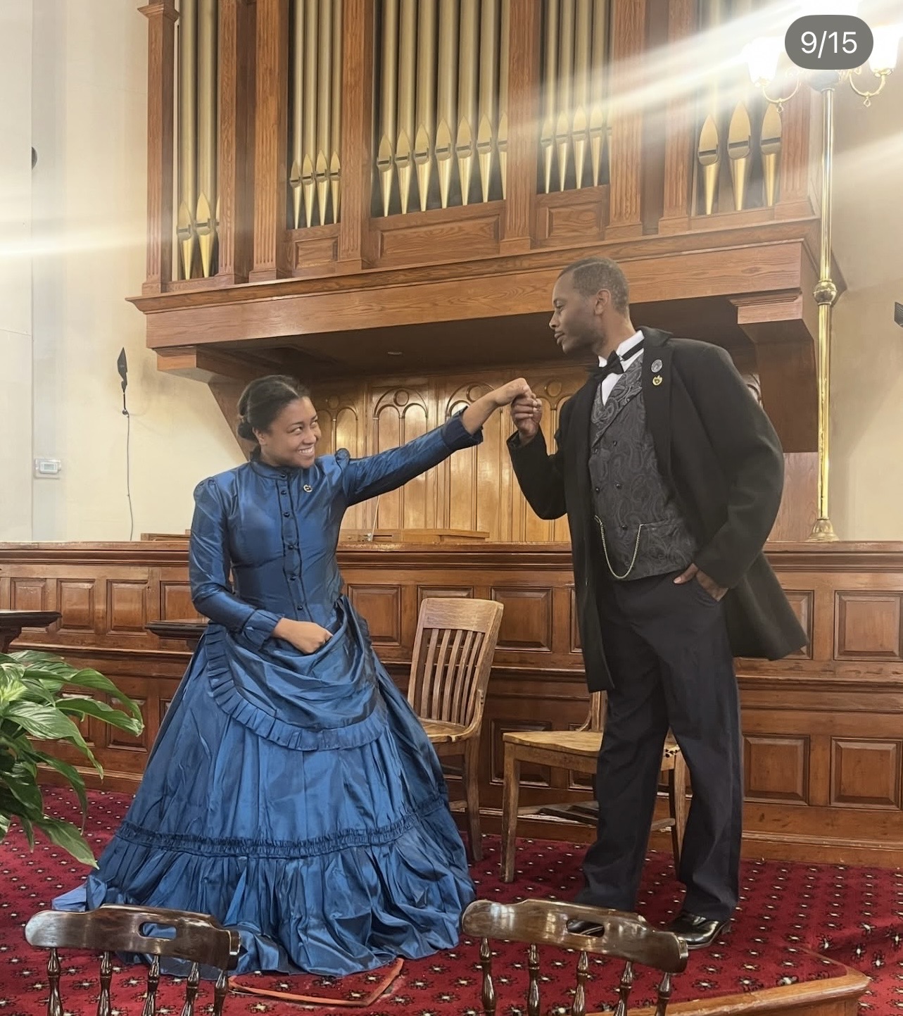 Octavius Catto and Caroline LeCount reenactors greet one another before an organ