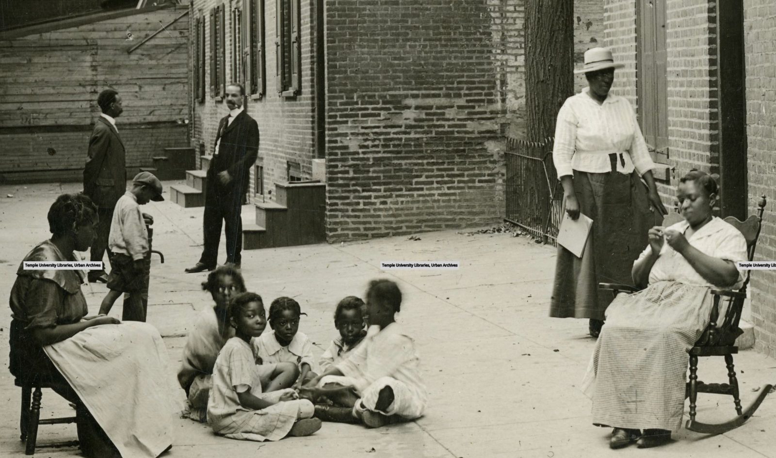 This community scene from the early 1900s in South Philadelphia is what we think Paschall's Alley may have looked like. '1326 Kenilworth Street' from Temple Special Collections, https://digital.library.temple.edu/digital/collection/p245801coll13/id/525/rec/30