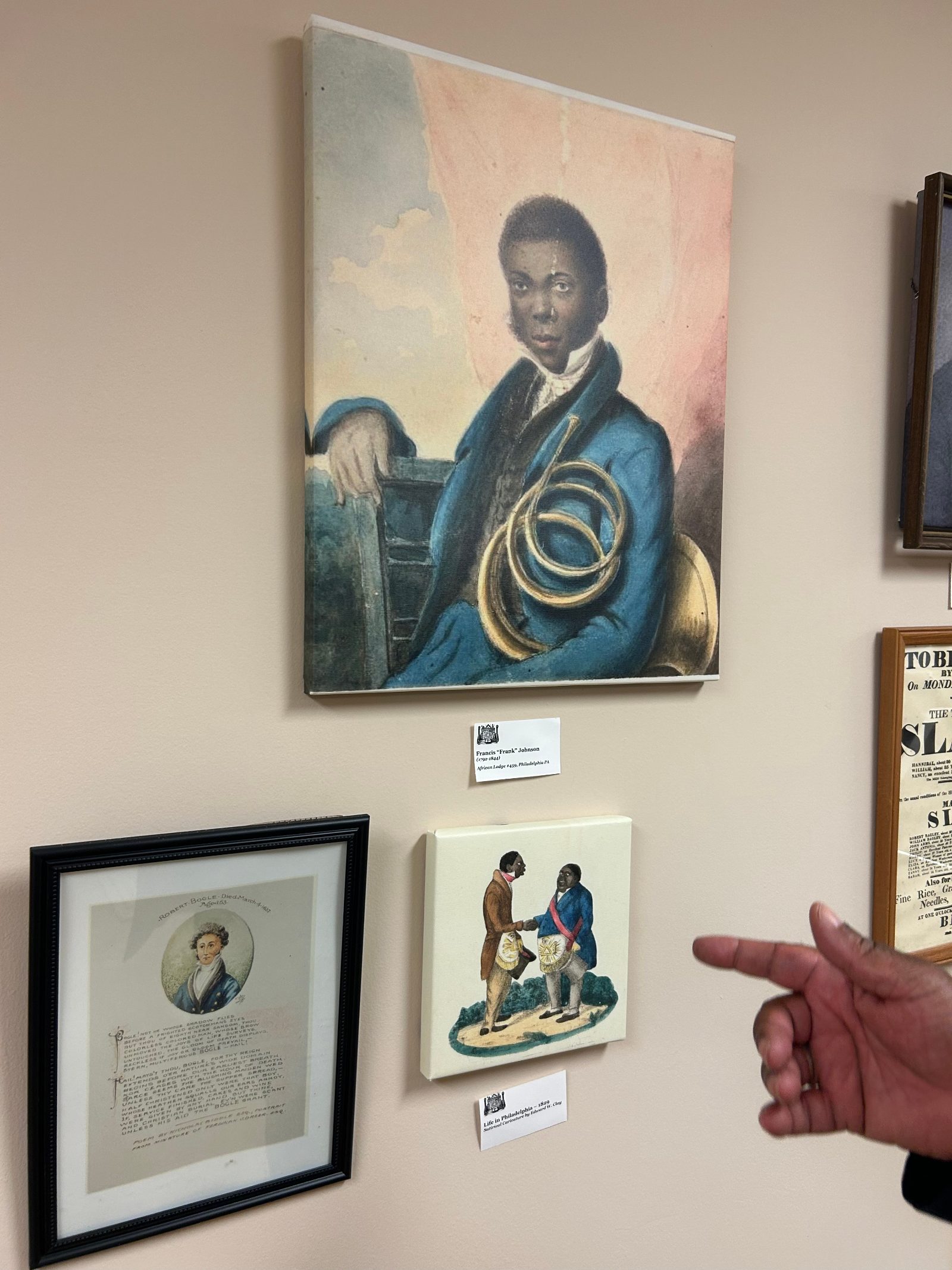 Worshipful Grand Historian Felix Gardenhire points to Frank Johnson's portrait at the Masonic Lodge Museum, December 11, 2024